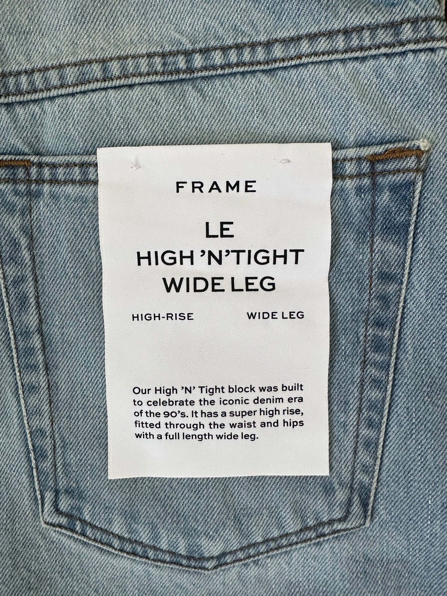 FRAME
Le High N Tight faded high-rise wide-leg jeans